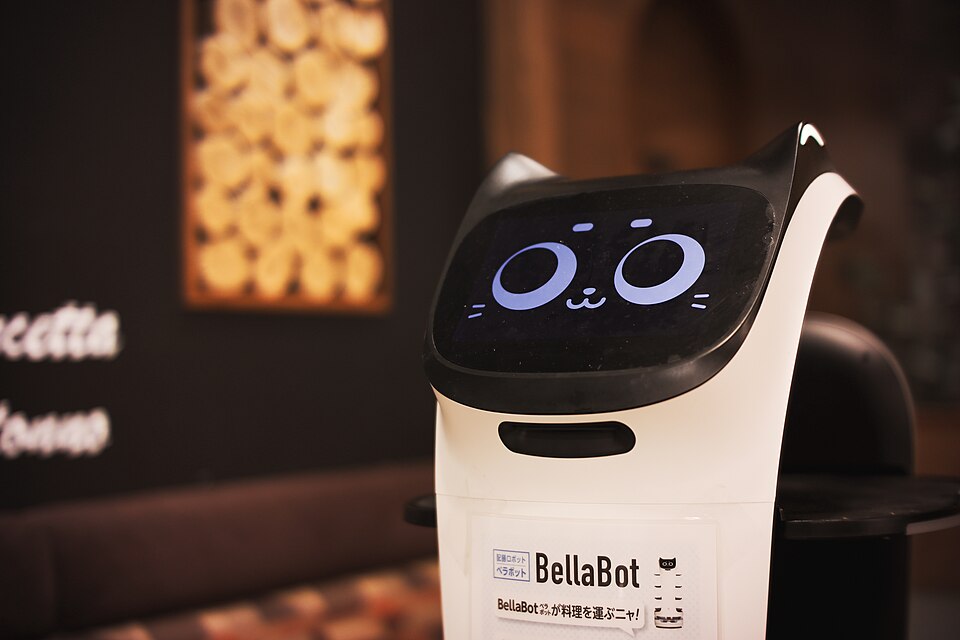 Pudu BellaBot service robot delivering food in a restaurant